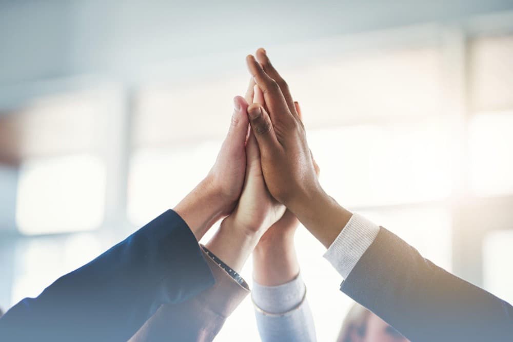 Hospital and Medicon teams bringing their hands together